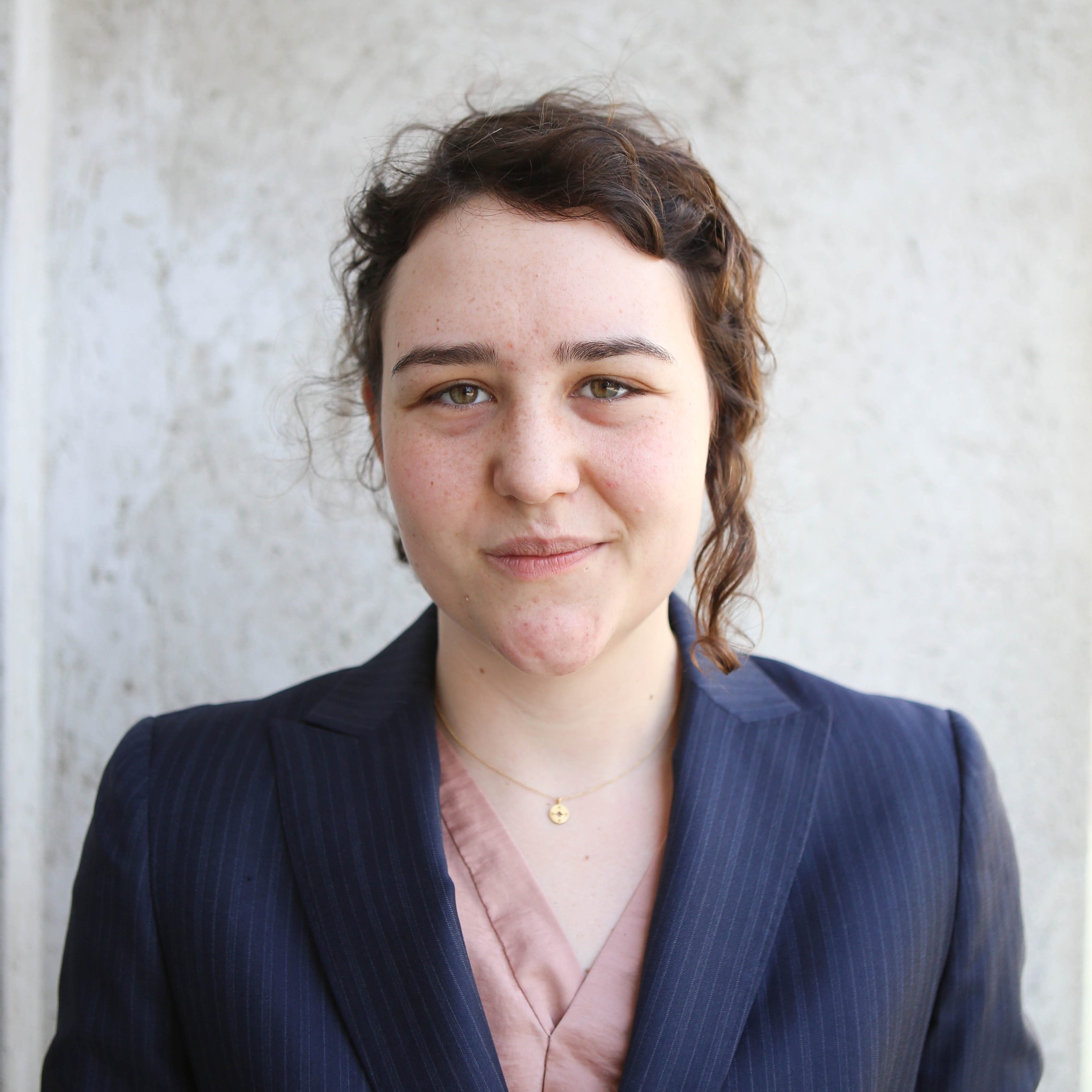 A portrait headshot of EMMA MCLEAN-RIGGS