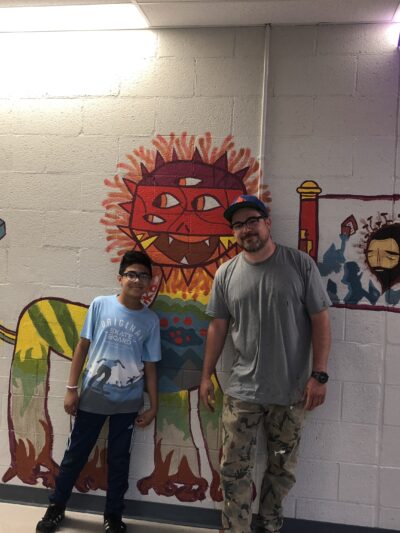 Denver student Miko McMahon-Piel and artist Jaime Molina's mural
