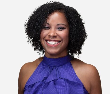 Portrait headshot of Erica Tinsley, Communications Officer, in front of a white background