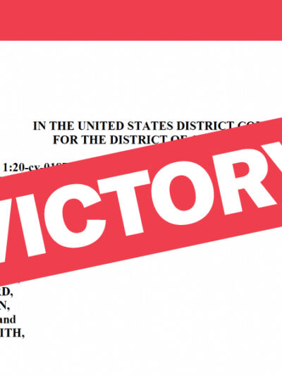 Victory text over original legal complaint in background