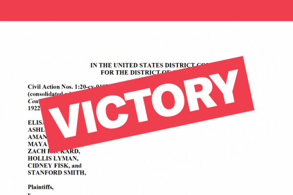 Victory text over original legal complaint in background