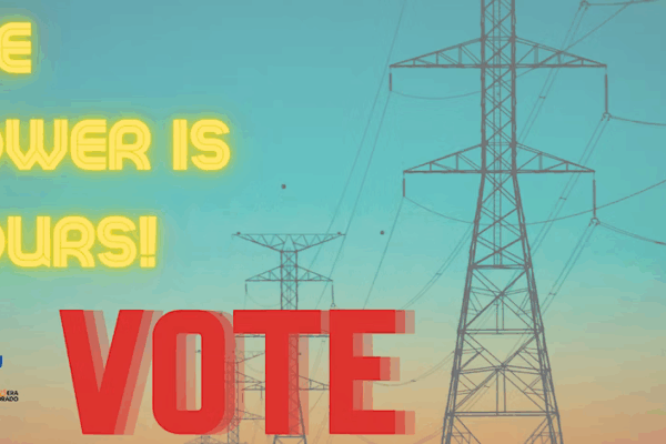 The power is yours! vote text over background of electricity pylons and sunset sky