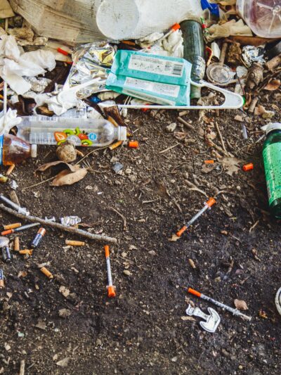pile of trash with needles