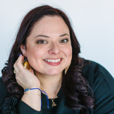 Headshot portrait photo of Suzie Post, smiling