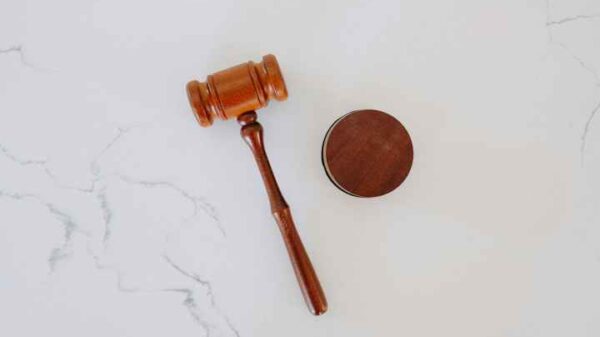 Photo of a gavel laying on white marble