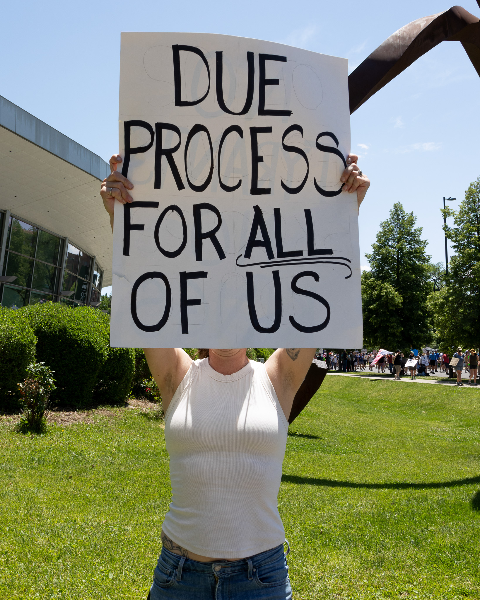 A protester holds a sign at a