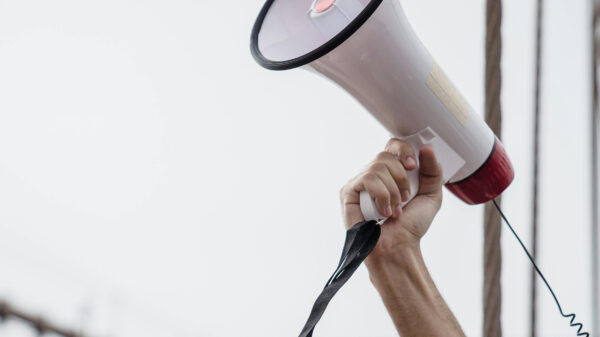 Photo of an arm holding a megaphone