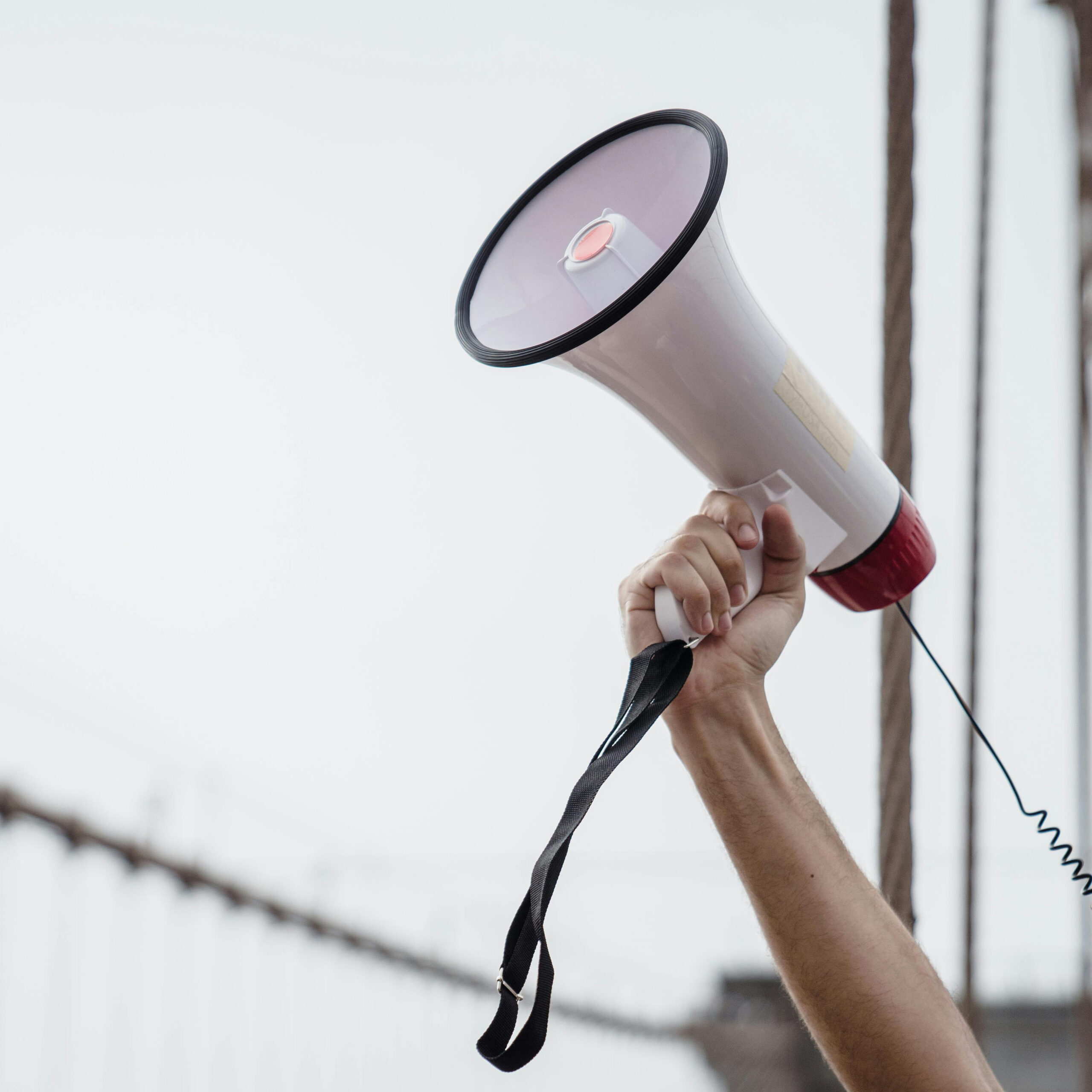 Photo of an arm holding a megaphone