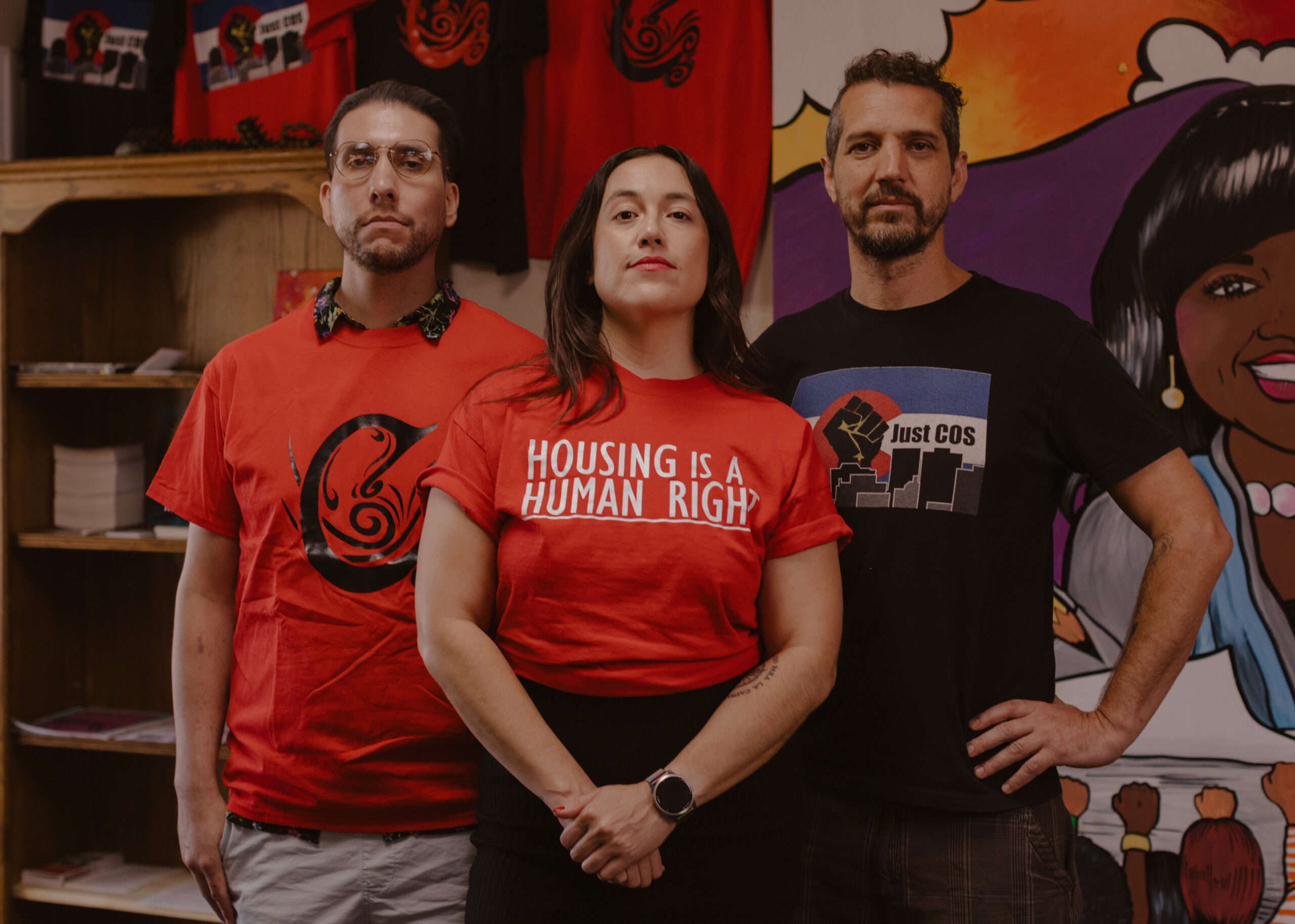 Photo of 3 ACLU clients wearing red and black shirts.