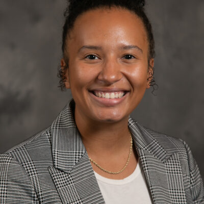 Headshot photo of Armania Heckenmueller smiling