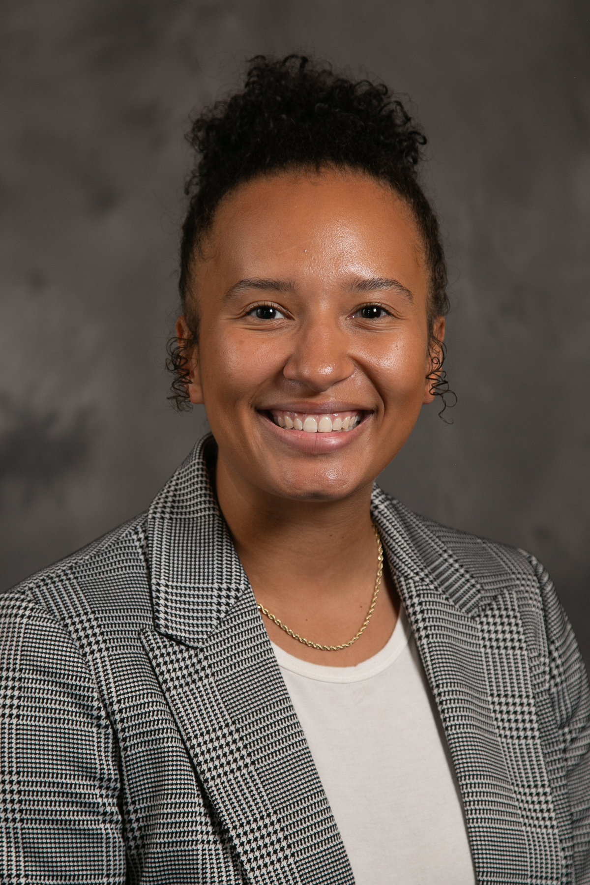 Headshot photo of Armania Heckenmueller smiling