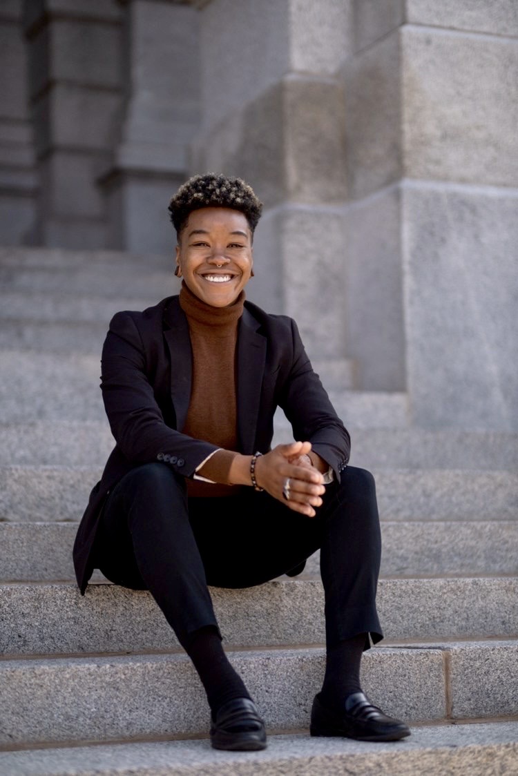 Photo of Basia Rose Mayah sitting on marble steps