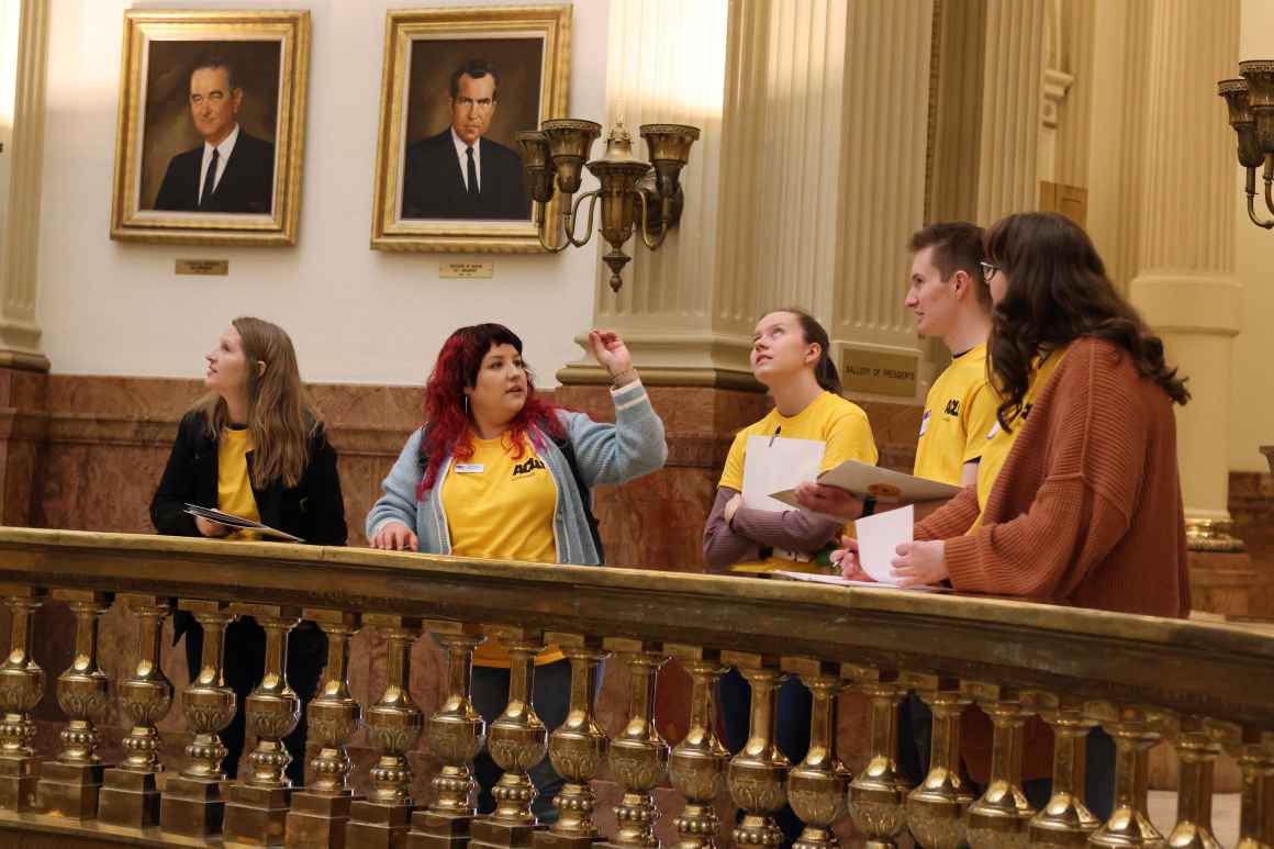 Lobby Leader Kassandra, leading LIFT attendees on a tour of the Colorado Capitol building