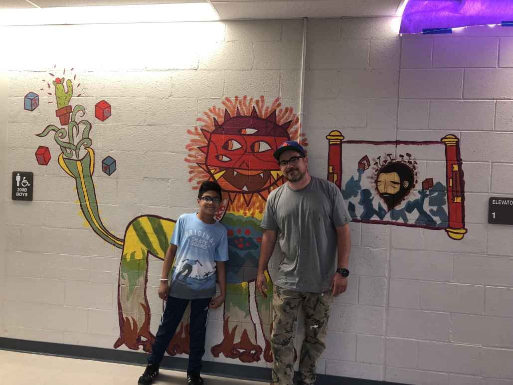 Denver student Miko McMahon-Piel and artist Jaime Molina's mural