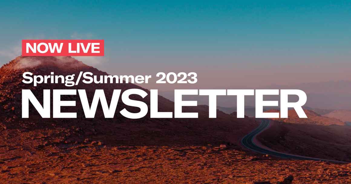 now live spring/summer 2023 newsletter text with photo of red hills and a road nearby