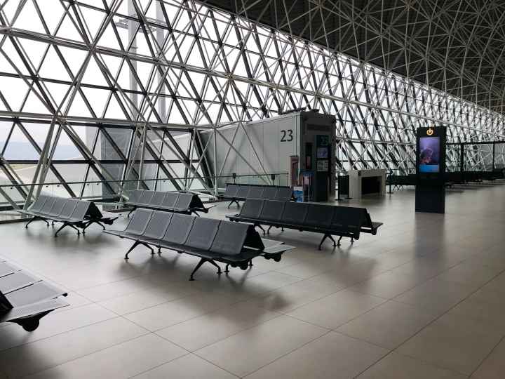 Photo of empty waiting area near an airport terminal