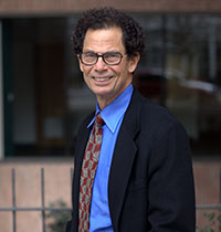 A portrait headshot of Mark Silverstein